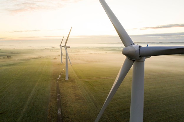 Three wind turbines at sunrise