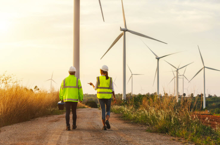 Maintenance technicians team working in wind turbine farm