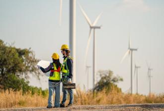 technicians at wind turbine farm