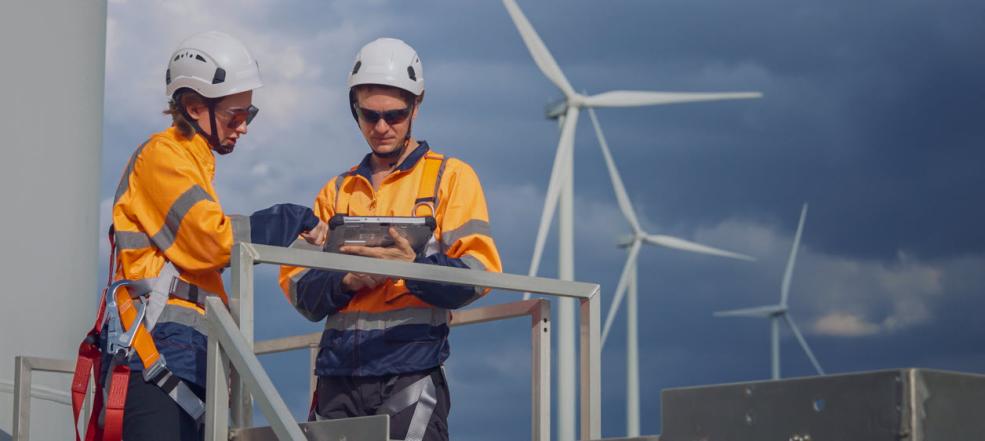 Wind Turbine Maintenance Team Working and Discussing Inspection